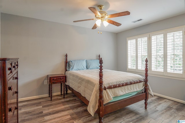 bedroom with hardwood / wood-style flooring and ceiling fan