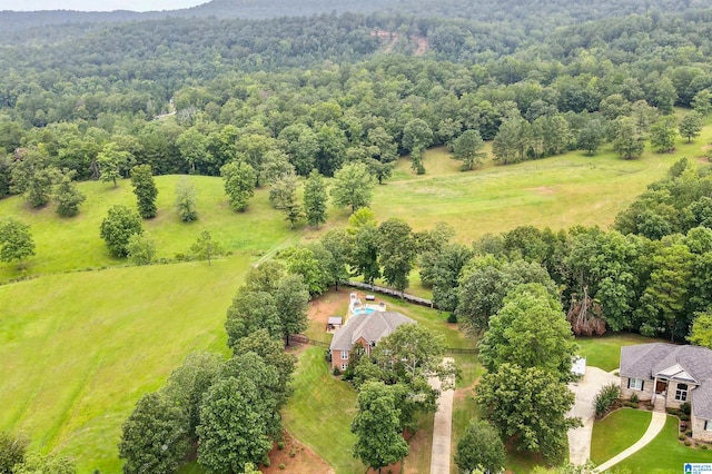 birds eye view of property with a rural view