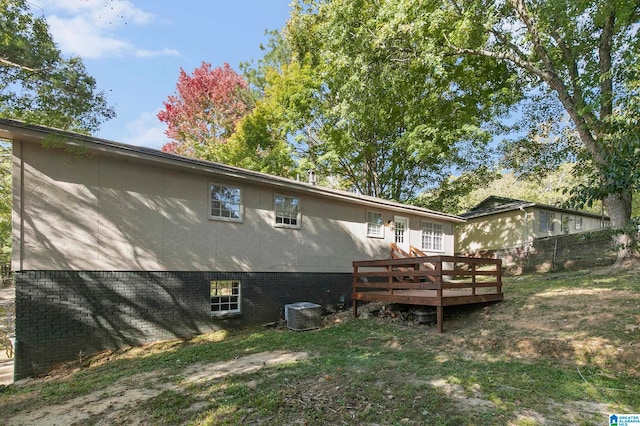 rear view of property with a deck