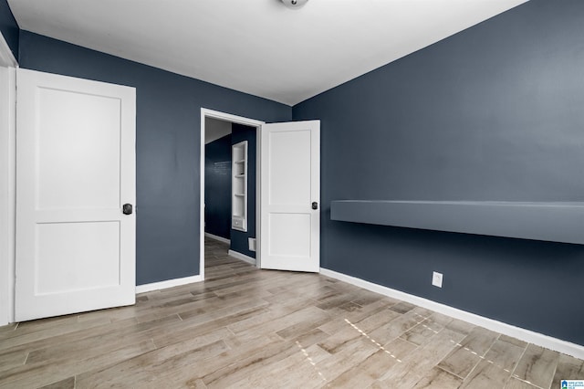 unfurnished bedroom featuring light hardwood / wood-style flooring