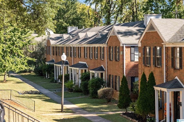 view of home's exterior with a lawn