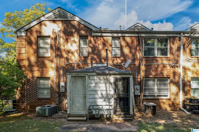 rear view of house with central air condition unit