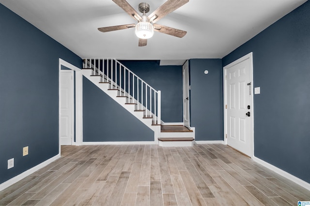 entryway with light hardwood / wood-style flooring and ceiling fan