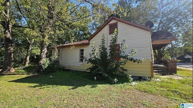 view of property exterior featuring a yard