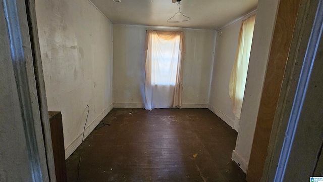 unfurnished room featuring dark wood-type flooring