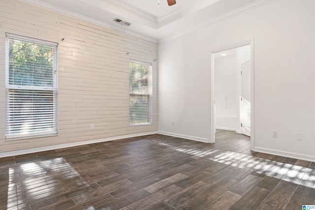 unfurnished room featuring crown molding, ceiling fan, and dark hardwood / wood-style flooring