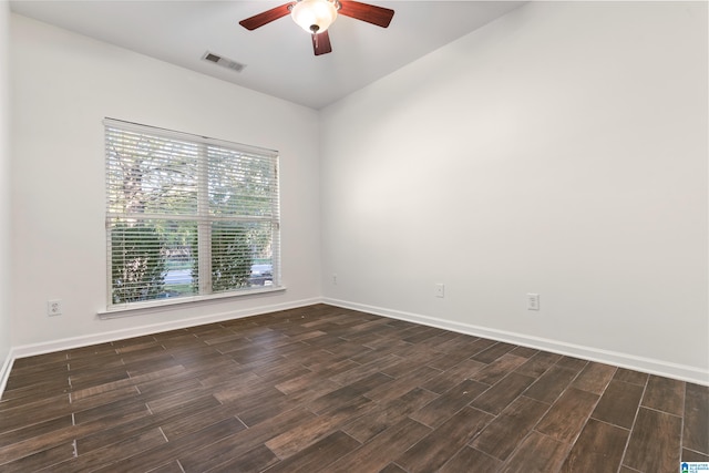 unfurnished room featuring dark hardwood / wood-style floors and ceiling fan