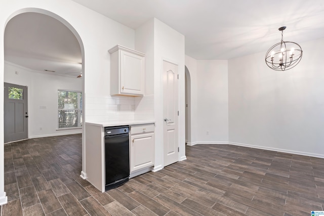 kitchen featuring decorative backsplash, white cabinetry, ceiling fan with notable chandelier, and dark hardwood / wood-style floors