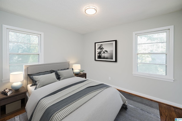 520 Hickory St, Birmingham, AL 35206 - bedroom with baseboards, multiple windows, and wood finished floors