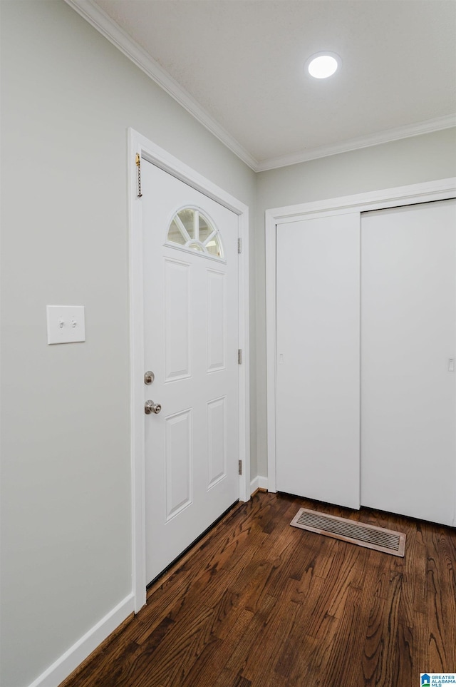 520 Hickory St, Birmingham, AL 35206 - foyer entrance featuring crown molding, baseboards, and dark wood-style flooring