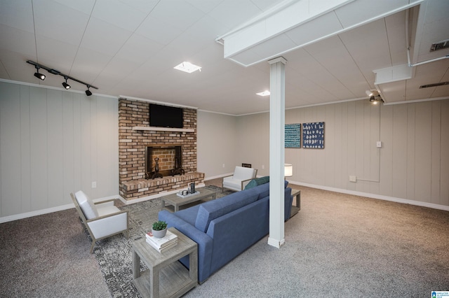 living room featuring crown molding, wood walls, and carpet