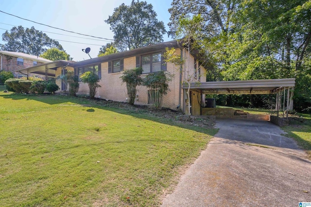 520 Hickory St, Birmingham, AL 35206 - view of side of property with driveway, a lawn, a carport, brick siding, and cooling unit
