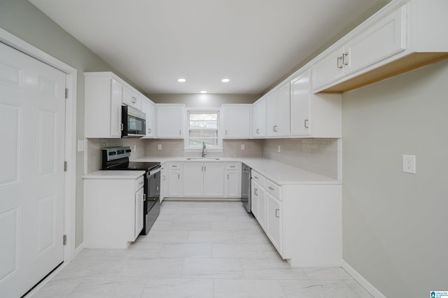 520 Hickory St, Birmingham, AL 35206 - kitchen featuring marble finish floor, white cabinetry, a sink, backsplash, and stainless steel appliances