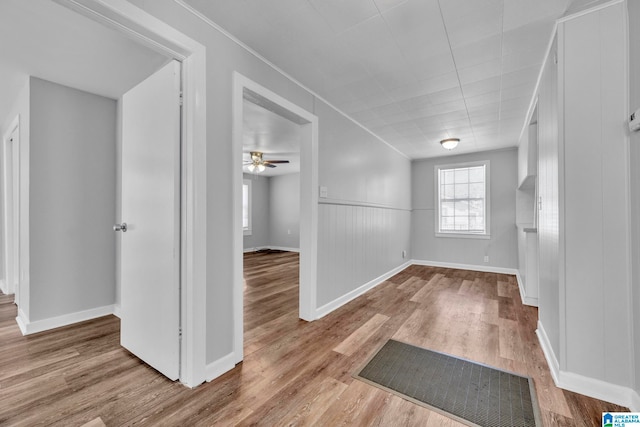 spare room featuring ceiling fan and light wood-type flooring