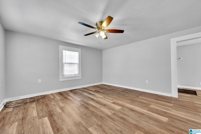 unfurnished room featuring ceiling fan and light wood-type flooring