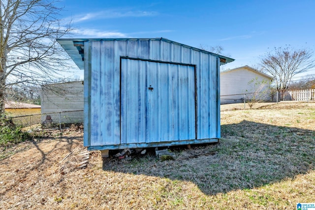 view of outdoor structure with a lawn