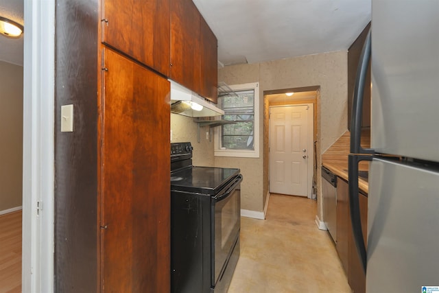 kitchen with exhaust hood and appliances with stainless steel finishes