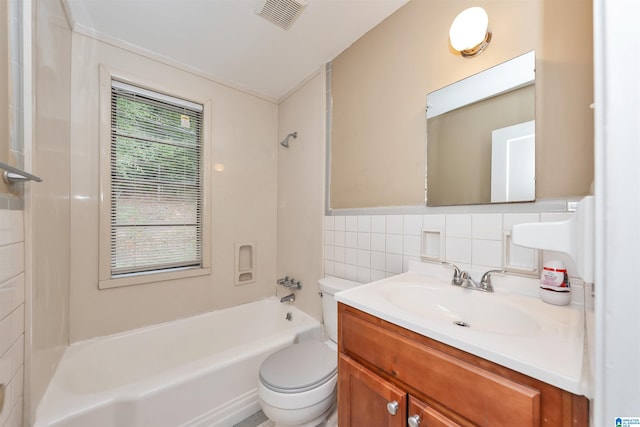 full bathroom with toilet, vanity,  shower combination, and tile walls