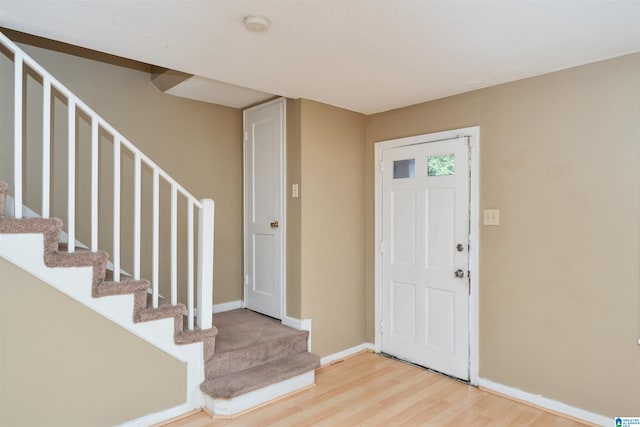 entrance foyer with hardwood / wood-style floors