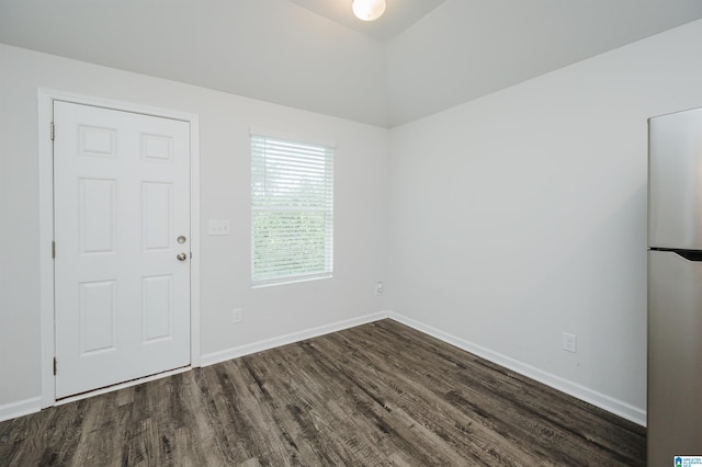 empty room featuring dark hardwood / wood-style flooring