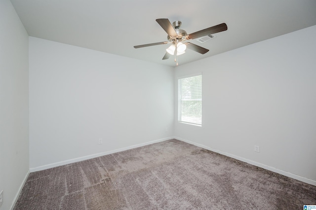 unfurnished room featuring ceiling fan and carpet floors