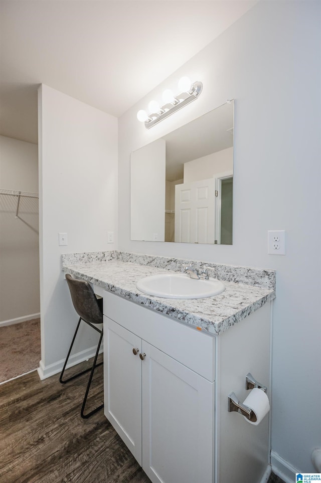 bathroom featuring vanity and hardwood / wood-style floors