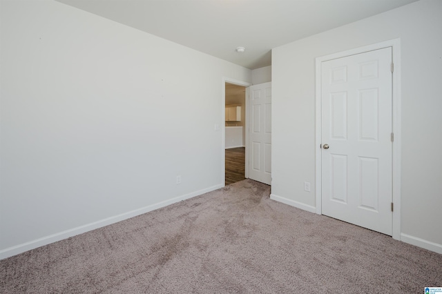 unfurnished bedroom with carpet floors