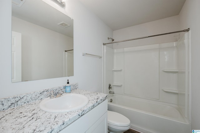 full bathroom featuring vanity, toilet, and shower / tub combination