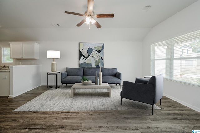 living room with lofted ceiling, dark wood-type flooring, and ceiling fan