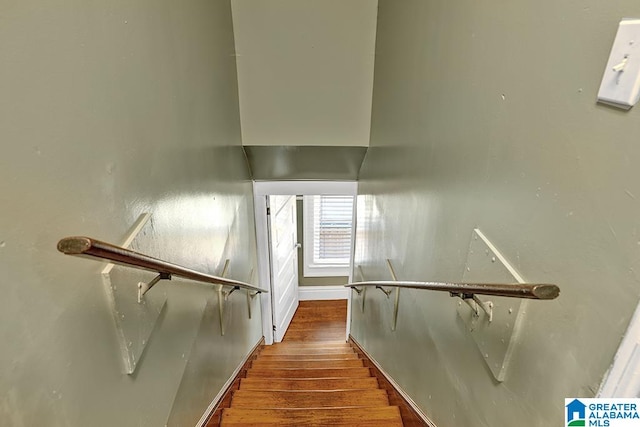 stairs with hardwood / wood-style flooring