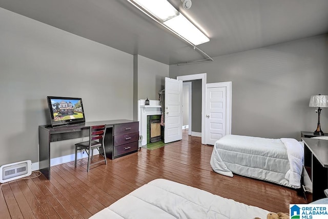 bedroom with hardwood / wood-style floors