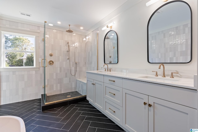 bathroom with tile patterned floors, vanity, and plus walk in shower