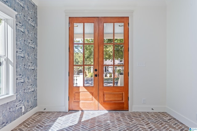 doorway to outside with french doors and a healthy amount of sunlight