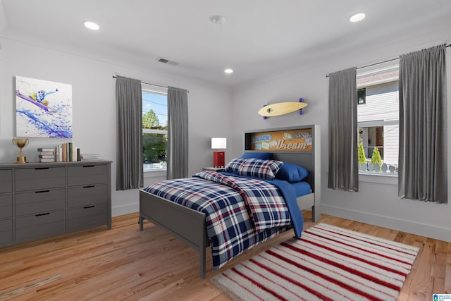 bedroom with light hardwood / wood-style floors