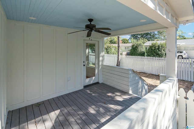 wooden terrace featuring ceiling fan