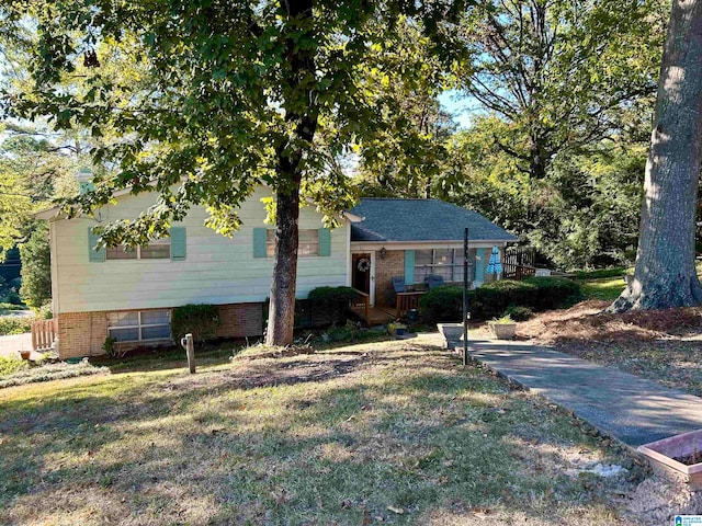 split level home featuring a front lawn