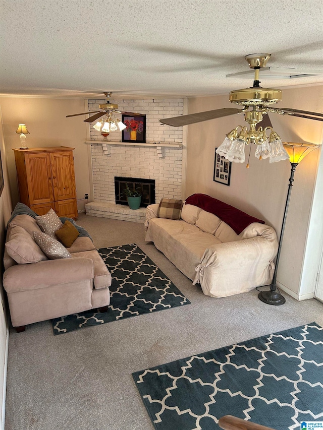 carpeted living room featuring ceiling fan, a textured ceiling, and a brick fireplace