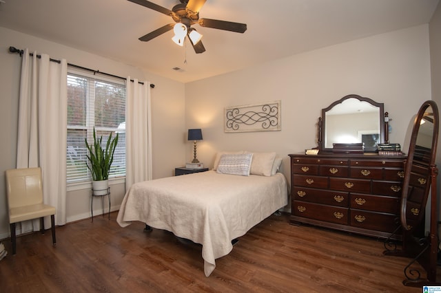 bedroom featuring ceiling fan and dark hardwood / wood-style flooring