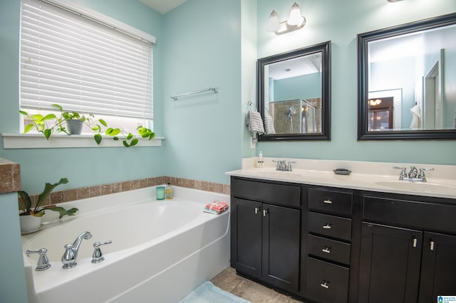 bathroom with vanity, independent shower and bath, and tile patterned flooring