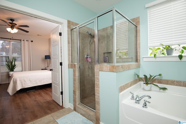 bathroom featuring hardwood / wood-style floors, separate shower and tub, and ceiling fan