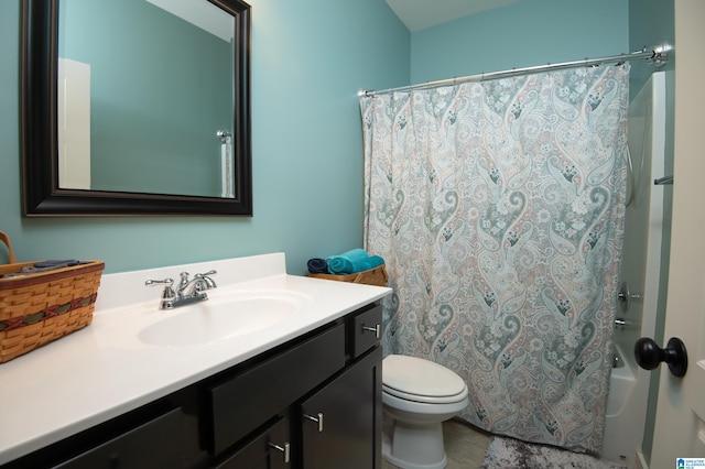 full bathroom with vanity, shower / tub combo with curtain, and toilet