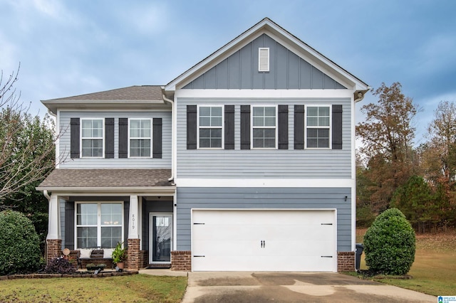 craftsman-style house featuring a front yard and a garage