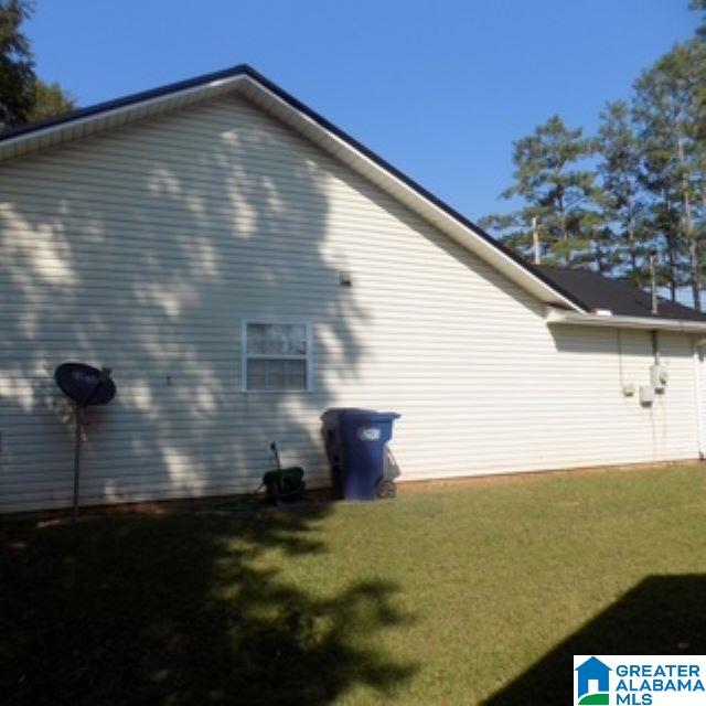 view of home's exterior featuring a lawn