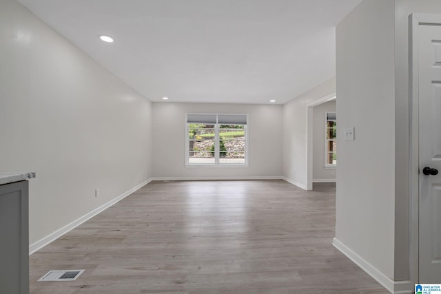 spare room featuring light wood-type flooring