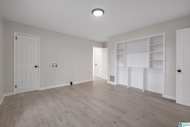 2720 20th Pl, Ensley, Birmingham, AL 35208 - unfurnished bedroom with light wood finished floors and baseboards