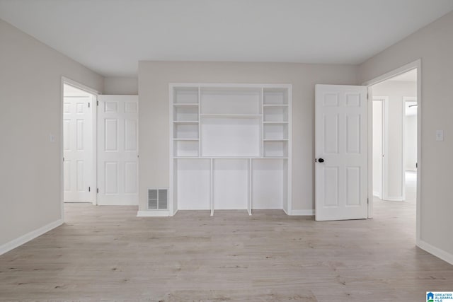 2720 20th Pl, Ensley, Birmingham, AL 35208 - unfurnished bedroom with baseboards, wood finished floors, and a closet