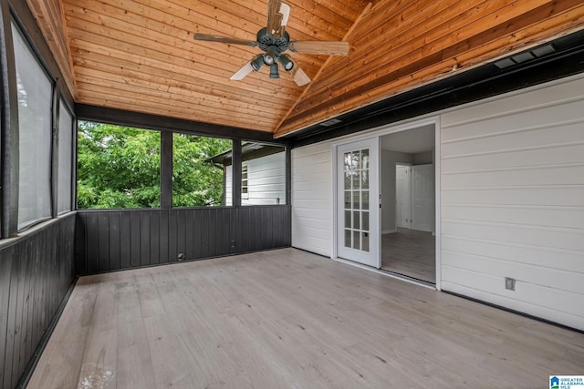 unfurnished sunroom featuring ceiling fan, wooden ceiling, and vaulted ceiling