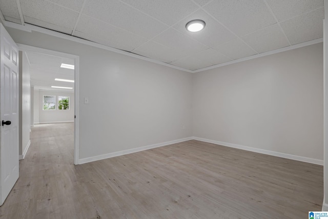 2720 20th Pl, Ensley, Birmingham, AL 35208 - spare room with light wood-style floors, baseboards, and a paneled ceiling