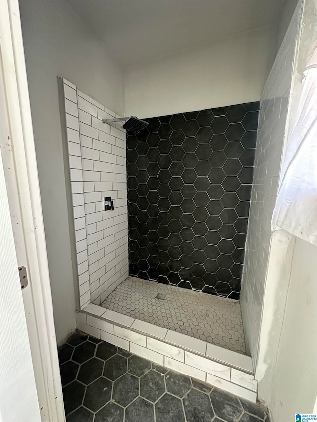 bathroom featuring tile patterned floors and tiled shower