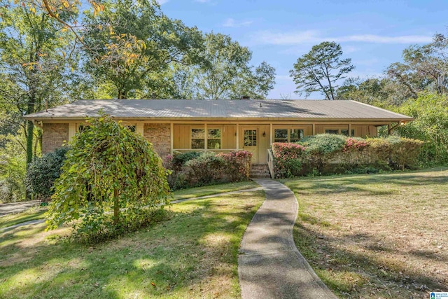 single story home featuring a front yard